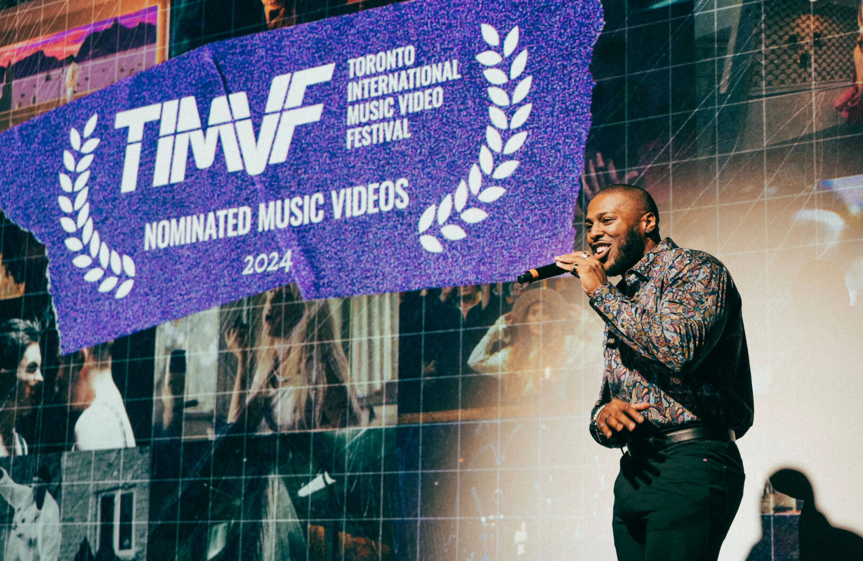 Photo of host on stage presenting nominees at the 2024 festival.